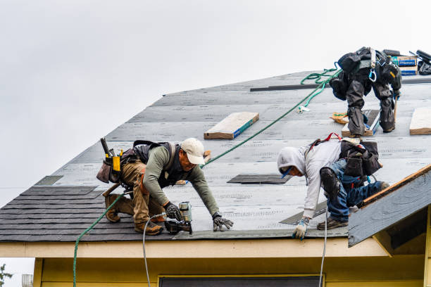 Professional Storm Damage Roof Repair technician working in Roslyn, WA